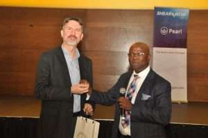 NAPE President-Elect, Mr. Abiodun Ogunjobi, FNAPE presents a gift to the Speaker Mr. Ed Hager, Chief Geophysicist Acquisition, Shearwater